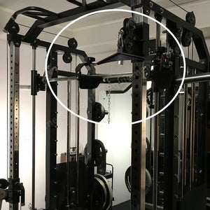 Gym equipment with a focus on the pulley system.
