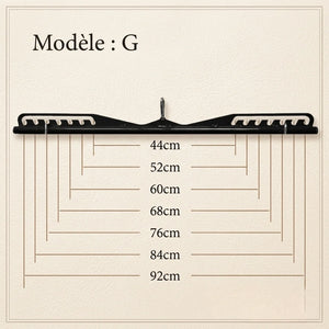 Black hanger with measurement markings on a beige background
